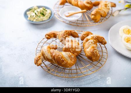 Easter brunch with bread bunny bun, egg spread and hard boiled eggs Stock Photo
