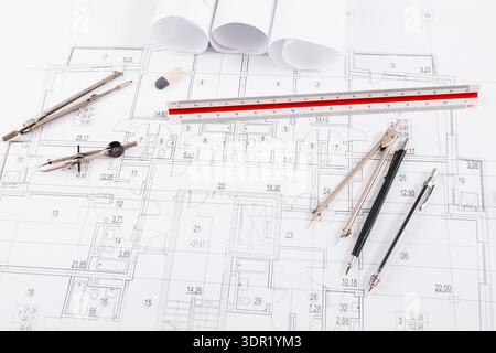 Plans for a Building Project With Tools and Materials on a Workspace in a Design Studio Stock Photo