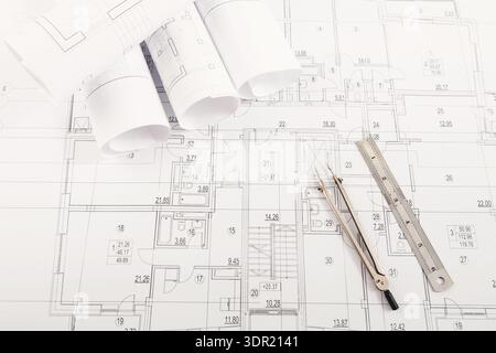 Blueprint Collection Featuring Detailed Architectural Plans and Drafting Tools on a Table Stock Photo