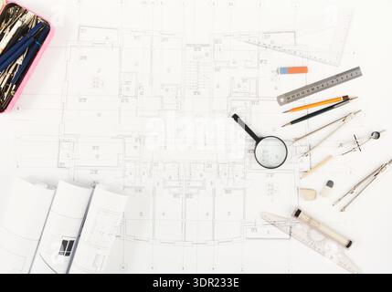 Collection of Architectural Tools and Plans on a Desk for Building Design and Drafting Work Stock Photo