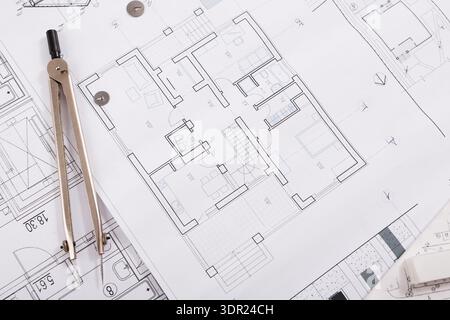 Blueprint Collage Showing Various Architectural Designs and Plans on a Workspace Table Stock Photo