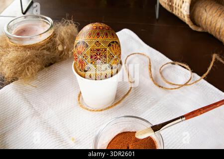 Traditional Ukrainian pysanka Easter egg with wax ornament and natural dyes Stock Photo