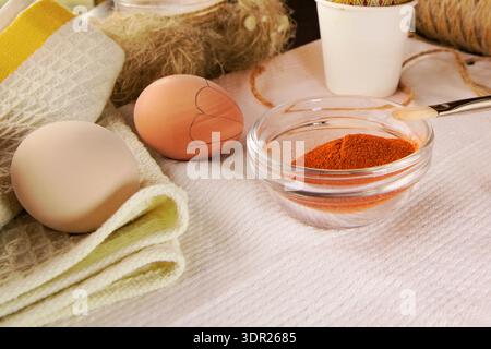 Preparing Easter eggs with wax tool candle and natural dyes Stock Photo