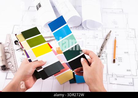 Color Selection in Design Process With Samples and Blueprints Displayed on a Table Stock Photo