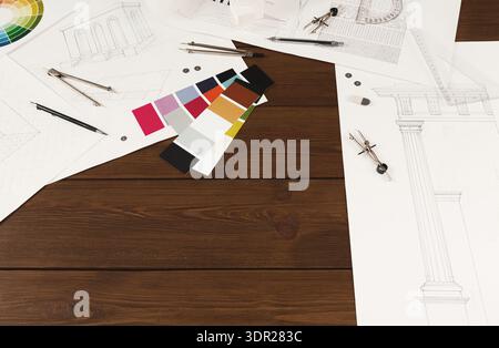 Collection of Architectural Drawings and Color Samples on a Wooden Table for Design Project Stock Photo
