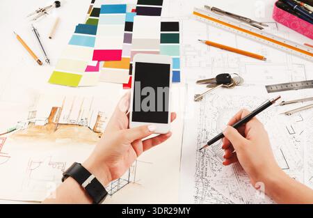 Collage of Design Materials and Tools Used for Creating a Project in a Workspace Setting Stock Photo