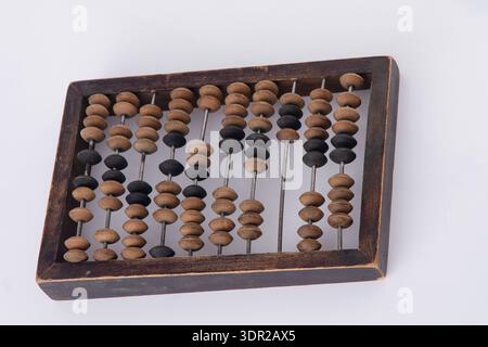 Old Wooden Abacus on White Background. Stock Photo