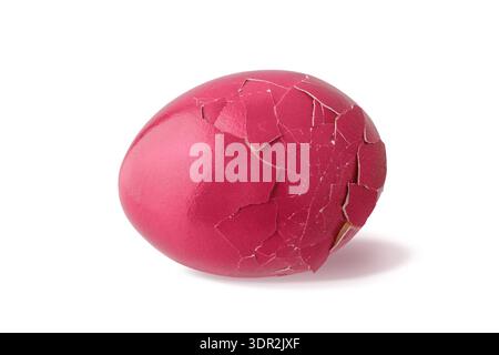 Brocken painted in viva magenta natural easter chicken egg with shadow isolated on white background. Egg colored in trendy color 2023 Viva Magenta Stock Photo