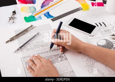 Creative Process in a Collage Set of Colorful Drawings and Tools on a Workspace Table Stock Photo