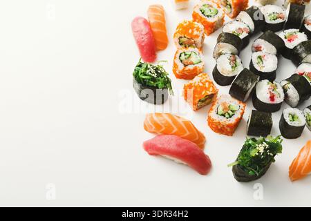 Different Types of Sushi Arranged in a Circular Pattern on a White Surface Stock Photo