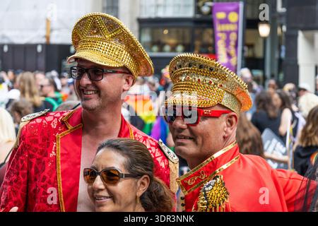Two men in red costumes celebrate at London Pride event. London, UK, 29 June 2024 Stock Photo
