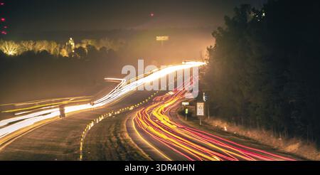 Super highway with high volume of cars at night Stock Photo