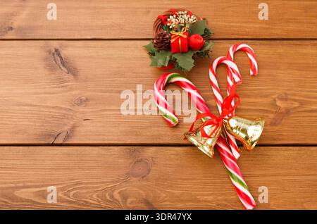 Collage of Candy Canes and Holiday Decor on Wooden Table During Christmas Season Stock Photo