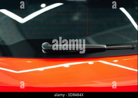 Car wiper close up. Part of a red car. High quality photo Stock Photo