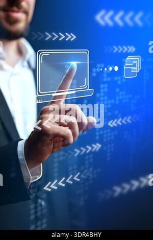 Person interacts with digital screen in business setting during daytime Stock Photo