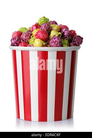 Caramelized fruit popcorn in red and white striped paper bucket isolated on white Stock Photo