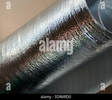 Abstract macro of shiny silver reflective insulation roll. Stock Photo