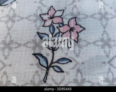 Elegant Pink Floral Illustration on Light Blue Woven Textile Texture | Detailed Macro Shot of Decorative Patterned Fabric for Fashion Design, Crafting Stock Photo