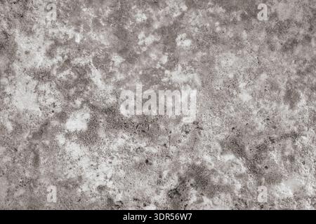 Grey natural stone texture close-up. Raw concrete or dark granite surface with rough mineral pattern Stock Photo