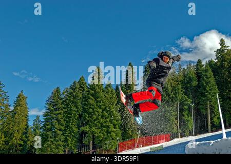 Snowboarder in the air. Stock Photo