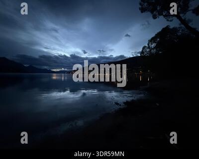 Afternoon scene of the lake with the moon coming out Stock Photo