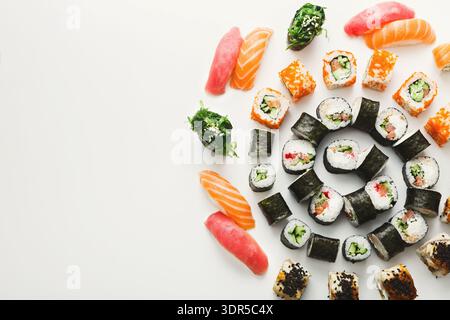 Different Types of Sushi Arranged in a Circular Pattern on a White Background Stock Photo