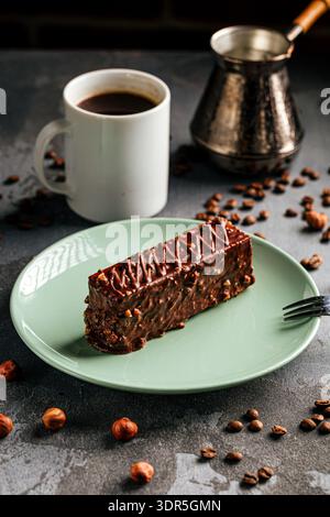 Chocolate nut cake slice with coffee cup Stock Photo
