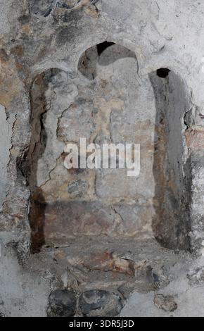The 14th-century medieval undercroft beneath Strangers’ Hall in Norwich, Norfolk. This vaulted stone structure served as a secure storage area for the wealthy merchant owners of the house, which is now a museum of domestic life. The brick and stone vaulting provided a fireproof foundation for the Great Hall above, reflecting the architectural sophistication of the city's prosperous textile and trading classes. Stock Photo