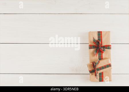 Gift Boxes Arranged on a Wooden Surface Decorated With Red and Green Ribbons Stock Photo