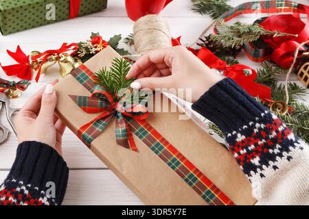 Creating a Gift With Careful Wrapping and Decoration During the Holiday Season Stock Photo