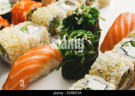 Sushi Variety on a Plate With Different Shapes and Colors Arranged for a Meal Stock Photo