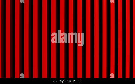 A repeating pattern of vibrant red and deep black vertical lines offers a bold graphic design element with a sense of depth and rhythm Stock Photo