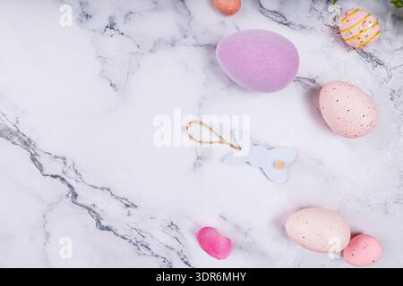Flat Lay of Easter Decor with Speckled Eggs and Bunny Stock Photo