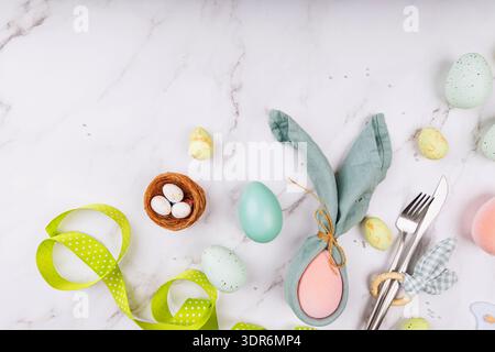 Easter Table Setting with Green Ribbon and Bunny Napkin Stock Photo