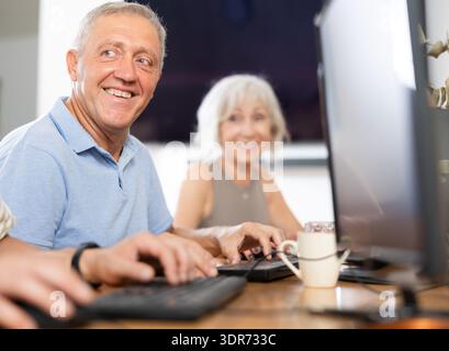 Group of older people studying on computer course Stock Photo