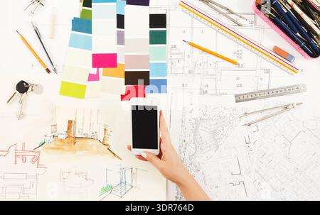 Creative Collage of Design Elements and Sketches on a Workspace Table With Tools and Materials Stock Photo