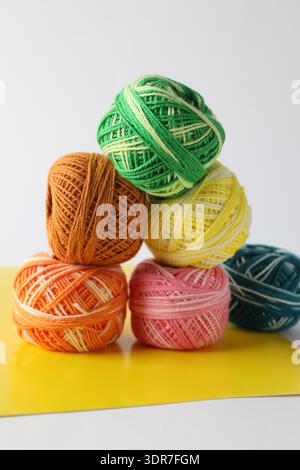 Many different spools of thread on light grey background, closeup Stock Photo
