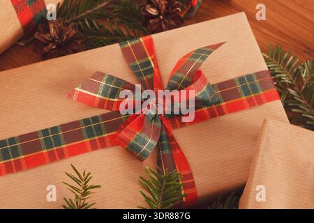 Different Gift Boxes With Ribbons and Decorations on a Wooden Table in a Festive Setting Stock Photo