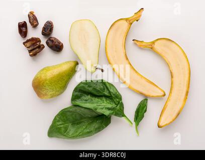 Different Fruits and Greens Arranged on a Surface With Variety of Shapes and Colors Stock Photo
