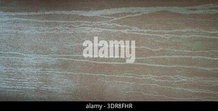 Natural stone texture background with subtle horizontal layers and earthy beige tones, photographed flat for abstract design use, ideal for architectu Stock Photo
