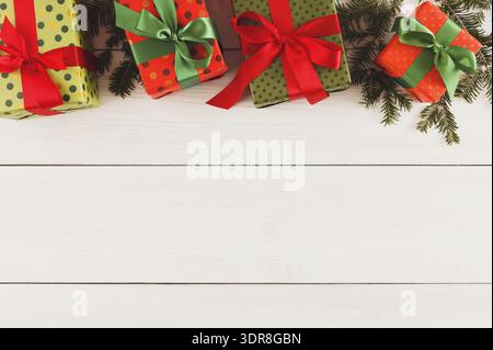 Colorful Gift Boxes Arranged on White Wooden Table for Celebration or Special Occasion Stock Photo