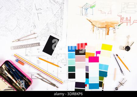 Collection of Design Elements and Tools on a Table for Architectural Projects Stock Photo