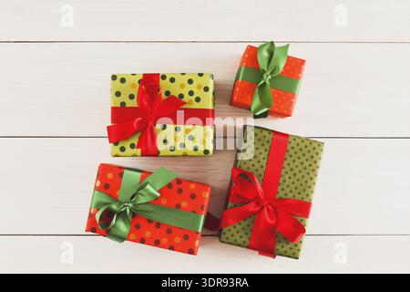 Collage of Gift Boxes Wrapped in Colorful Paper and Ribbons on a Wooden Surface Stock Photo