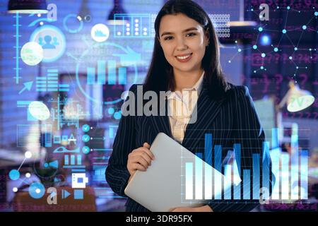 Double exposure of virtual screen with diagrams and female business analyst with laptop in office Stock Photo