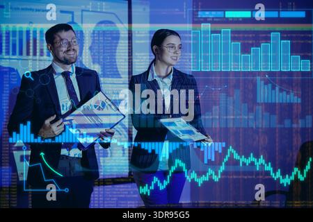 Double exposure of virtual screen with diagrams and business analysts near projector screen in office Stock Photo