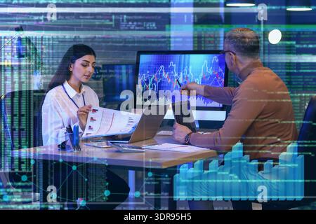 Double exposure of virtual screen with diagrams and business analysts working in office Stock Photo