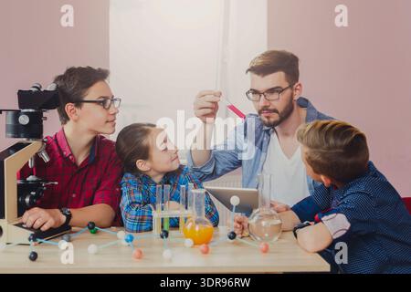 Students Learn Science Concepts Through Hands-On Experiments in a Classroom Setting Stock Photo