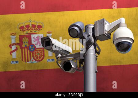 Closed circuit camera Multi-angle CCTV system against the background of the national flag of Spain. Stock Photo