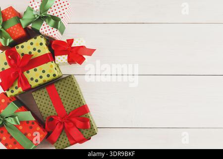 Colorful Set of Gift Boxes Arranged on a Wooden Surface for a Special Occasion or Celebration Event Stock Photo