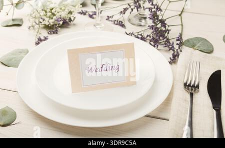 Elegant Wedding Table Setting With Floral Decorations and Place Card Stock Photo